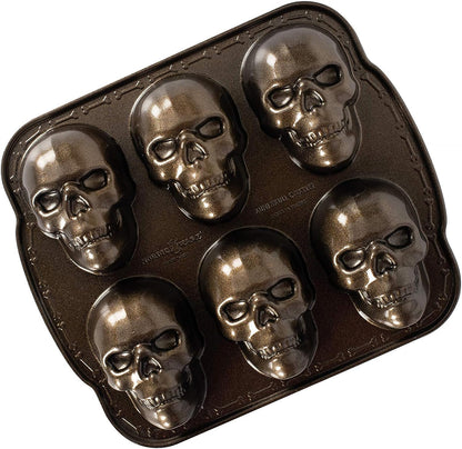 "Spooktacular Haunted Skull Cakelet Pan - Perfect for Halloween Baking!"